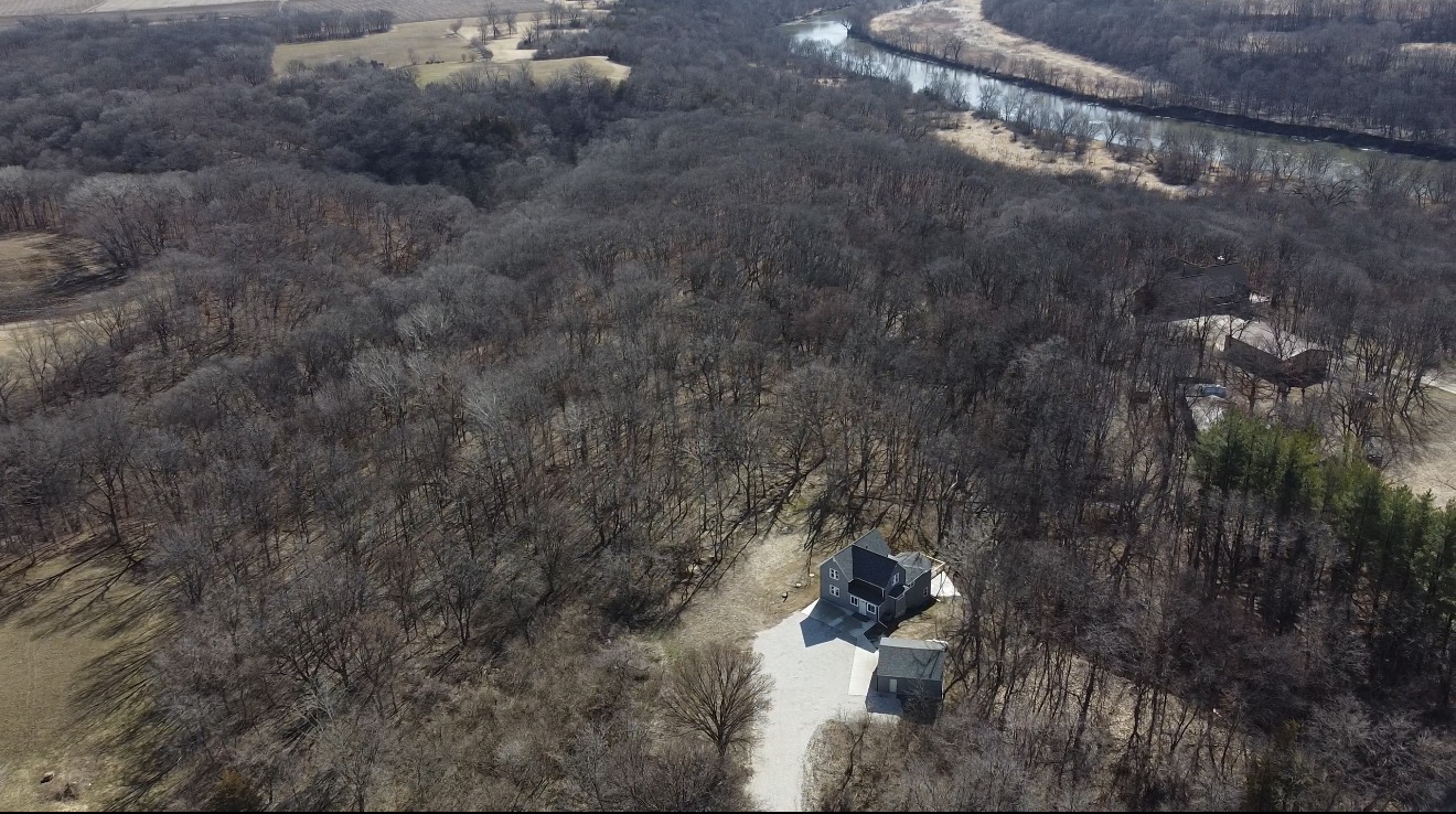 Aerial drone photograph of an Iowa property and acreage